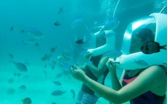 Walk on the seabed and be surrounded by lively fish during this helmet diving tour in Boracay Island.