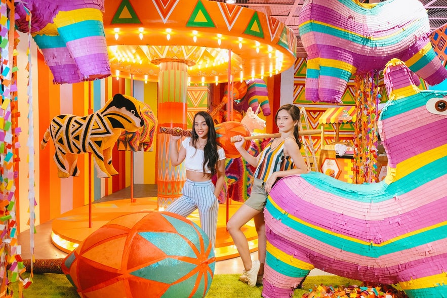 Guests posed beside the giant pinata attractions at the Dessert Museum. Guests posed beside the giant pinata attractions at the Dessert Museum.