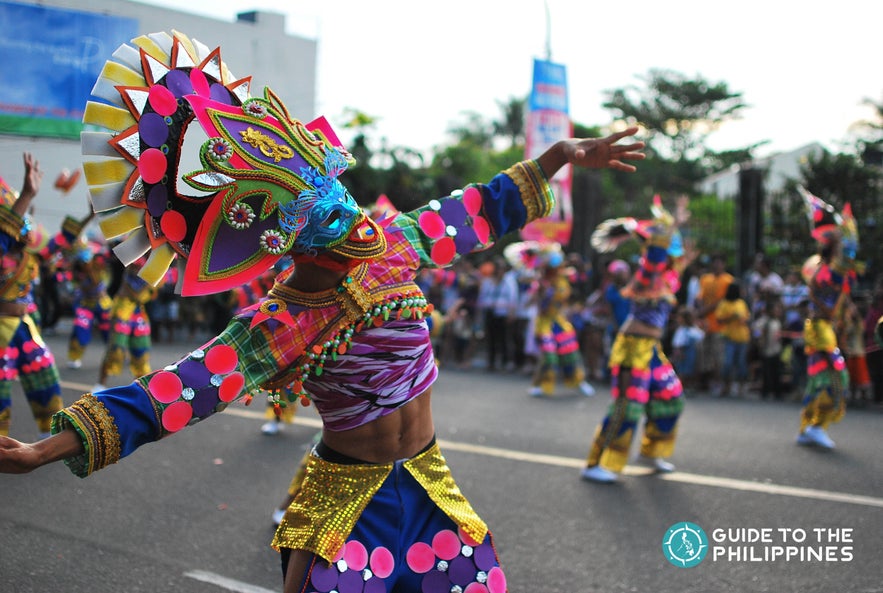 Participant of MassKara Festival street dance parade. Participant of MassKara Festival street dance parade.