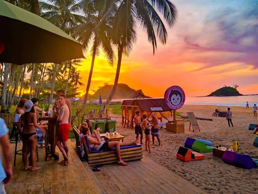 Sunset view at Mad Monkey Hostel Nacpan Beach in El Nido, Palawan Sunset view at Mad Monkey Hostel Nacpan Beach in El Nido, Palawan