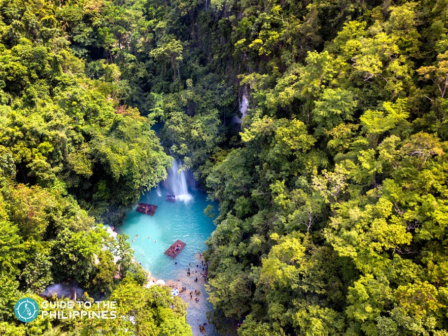 Aerial view of Kawasan Falls with many travellers Aerial view of Kawasan Falls with many travellers