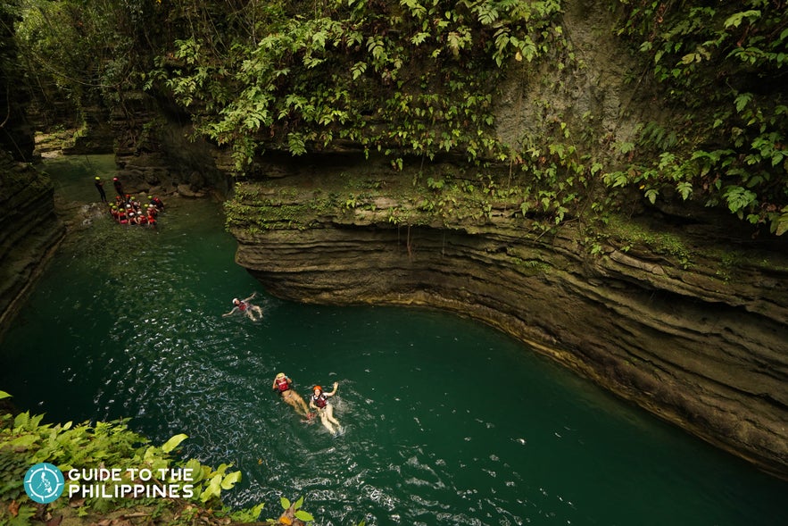 People canyoneering to Kawasan Falls People canyoneering to Kawasan Falls
