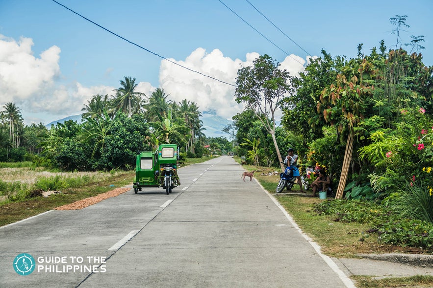 Tricycle bringing travelers around the Catanduanes neigborhood Tricycle bringing travelers around the Catanduanes neigborhood