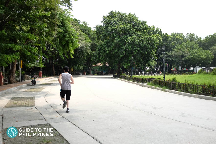 Man jogging in Quezon City Memorial Circle Man jogging in Quezon City Memorial Circle