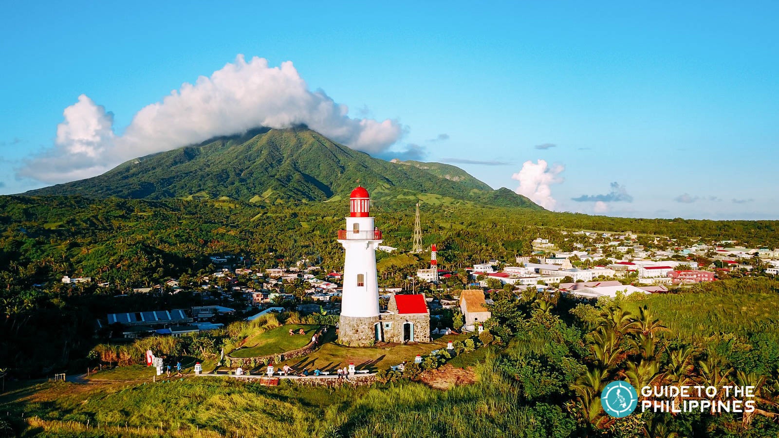 Sunset view of the Basco Lighthouse in front of Mt. Iraya