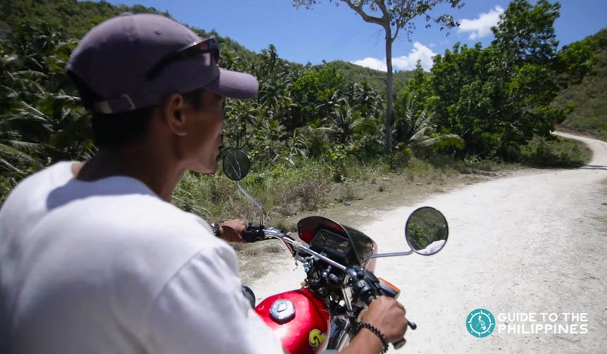 Man riding a motorcycle in Cebu Man riding a motorcycle in Cebu