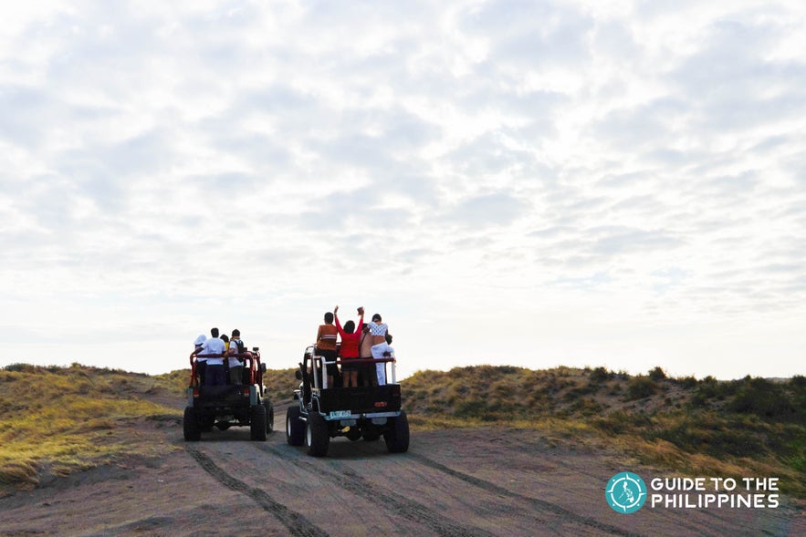 People during atv ride in Paoay Sand Dunes People during atv ride in Paoay Sand Dunes
