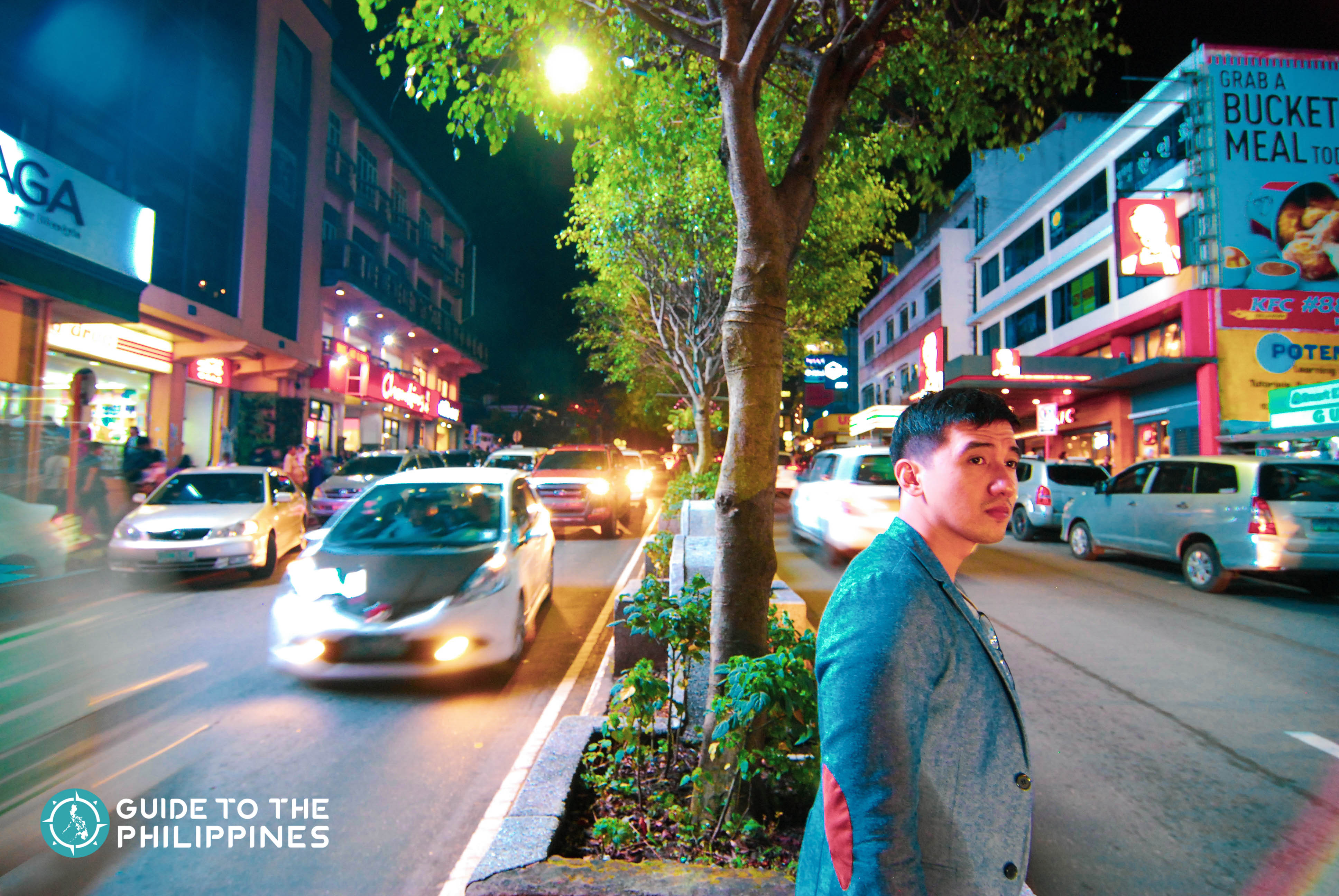 Traveler crossing the Session Road at night