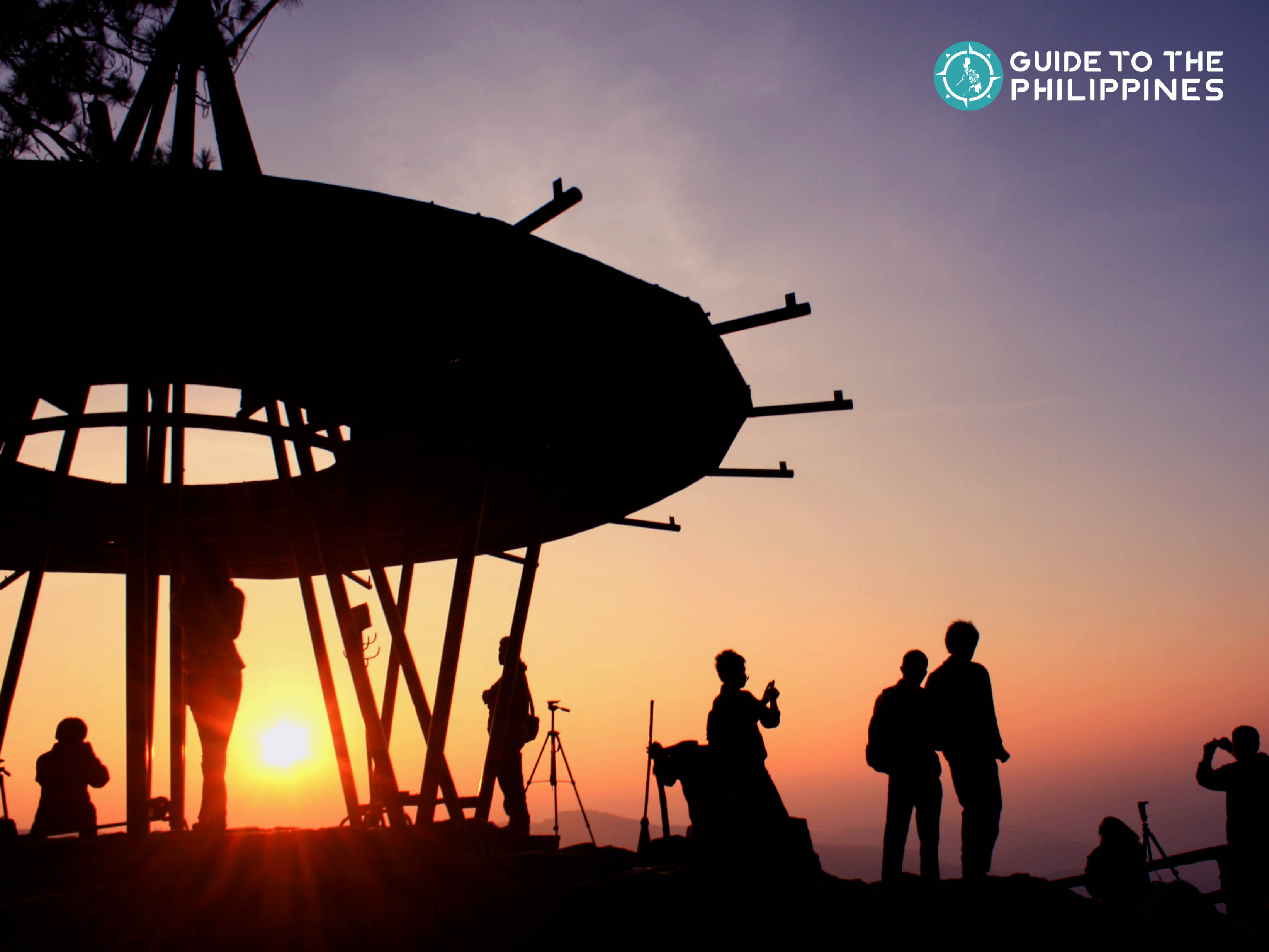 Travelers catching the sunrise at the Mines View Park in Baguio City, Philippines
