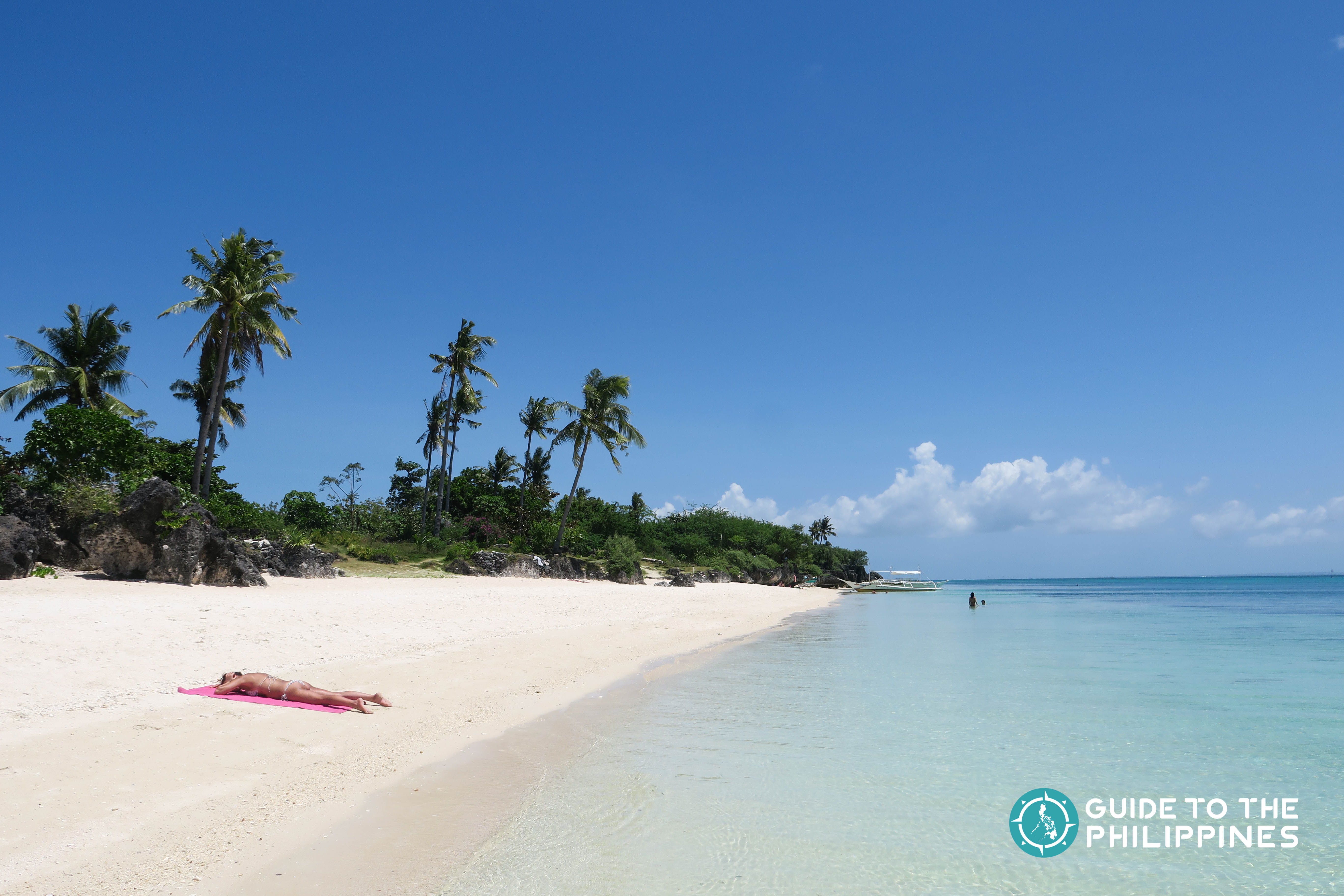 Traveler basking under the sun at Paradise Beach in Bantayan Island of Cebu
