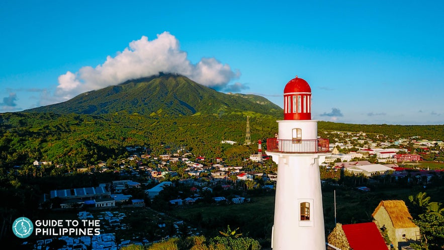 Basco Lighthouse in Basco, Batanes with Mt. Iraya in the background Basco Lighthouse in Basco, Batanes with Mt. Iraya in the background