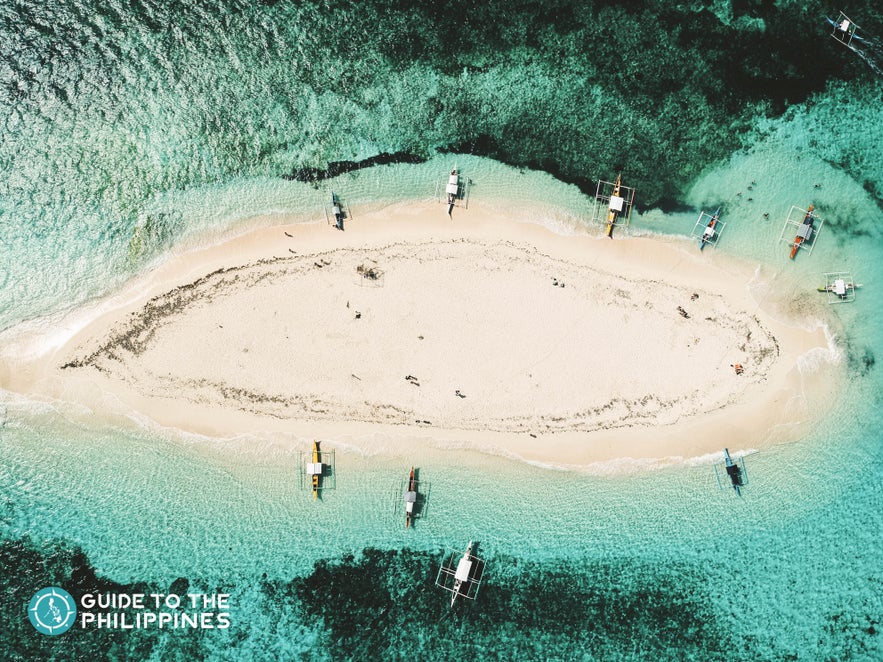 Top view of Siargao's Naked Island and its surrounding turquoise waters Top view of Siargao's Naked Island and its surrounding turquoise waters