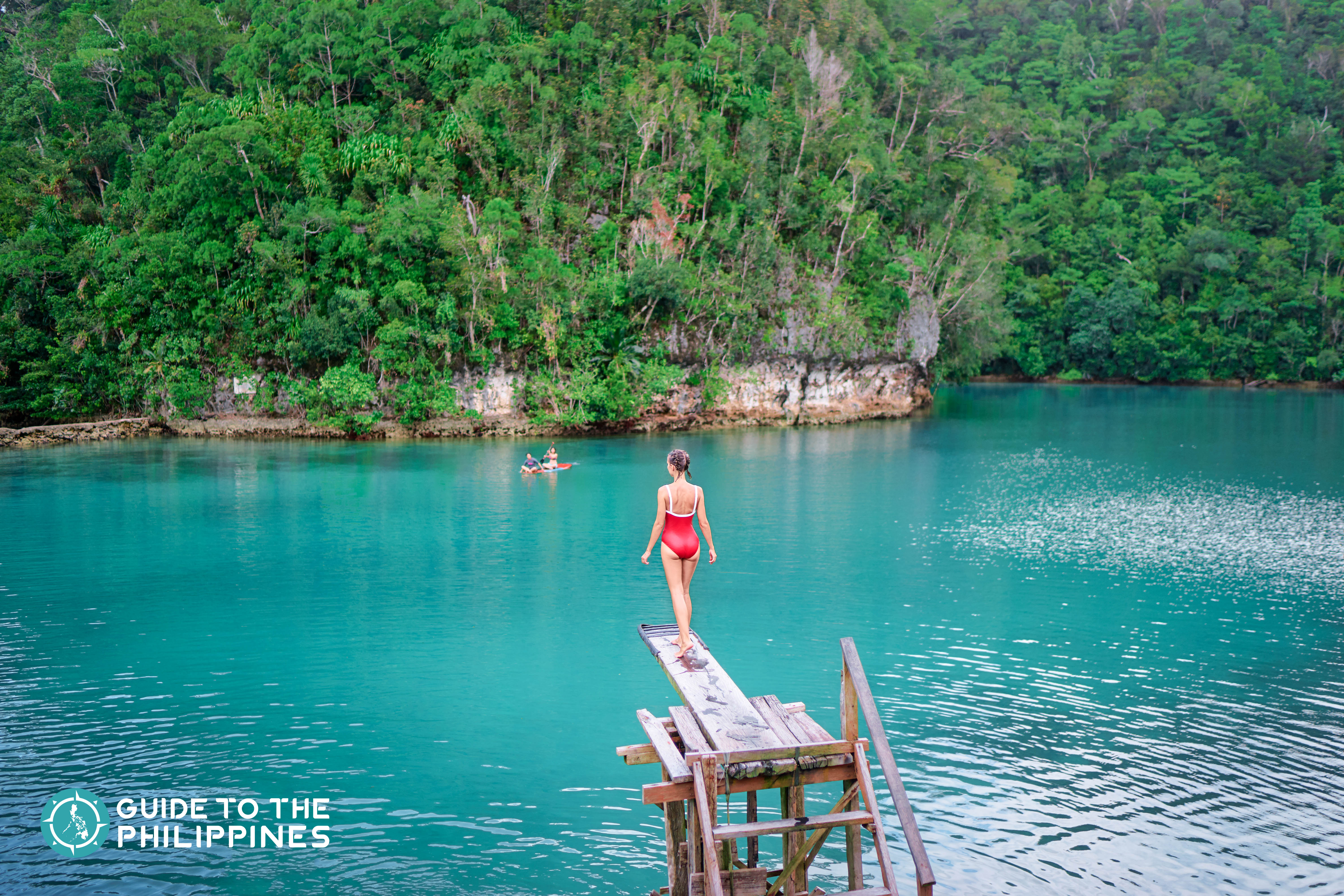 Girl about to jump off into the Sugba Lagoon of Siargao