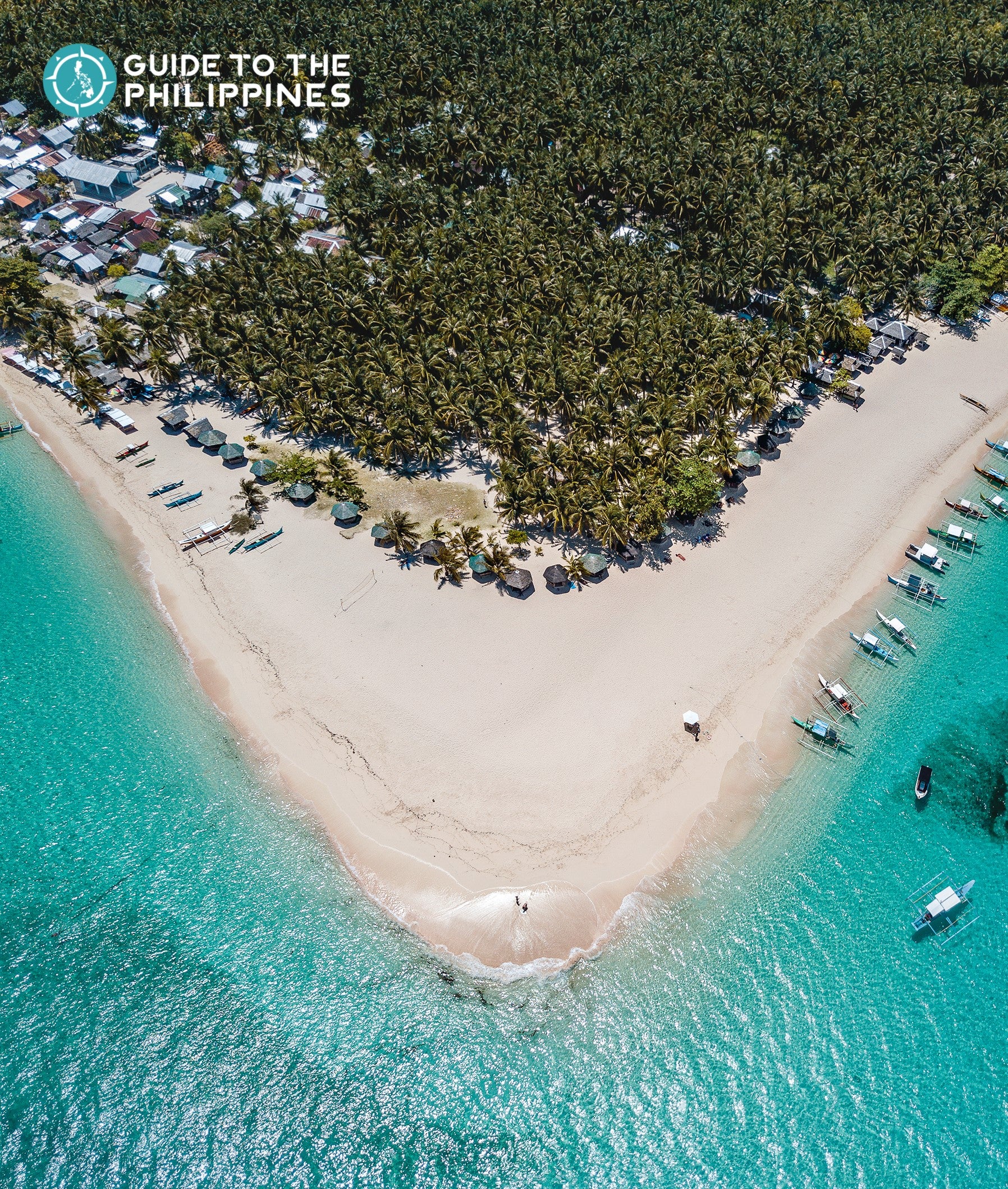 Top view of Daku Island's beach and coconut trees
