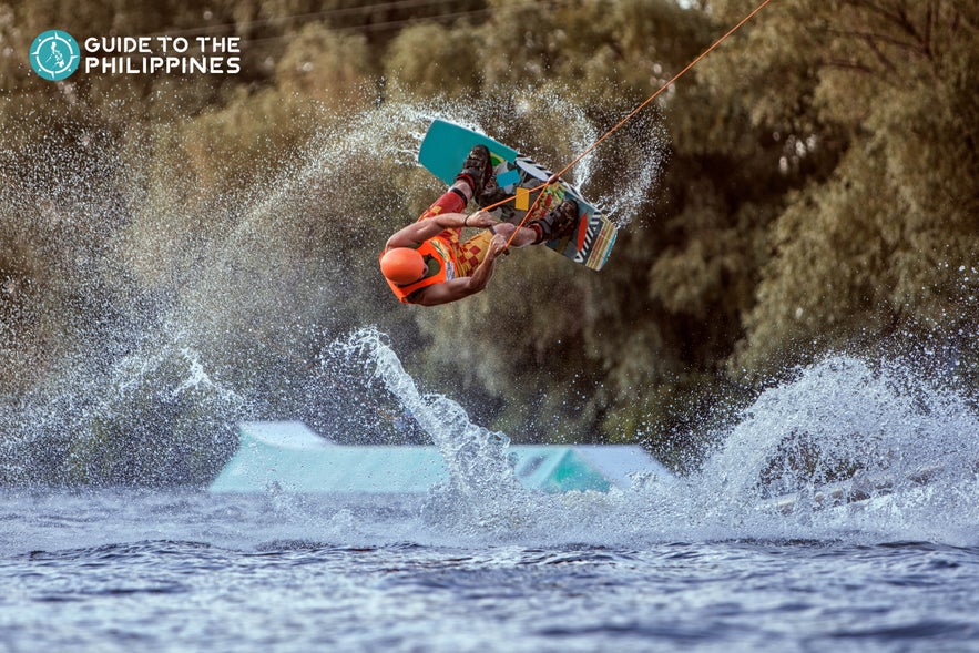 Man does an extreme jump on wakeboard Man does an extreme jump on wakeboard
