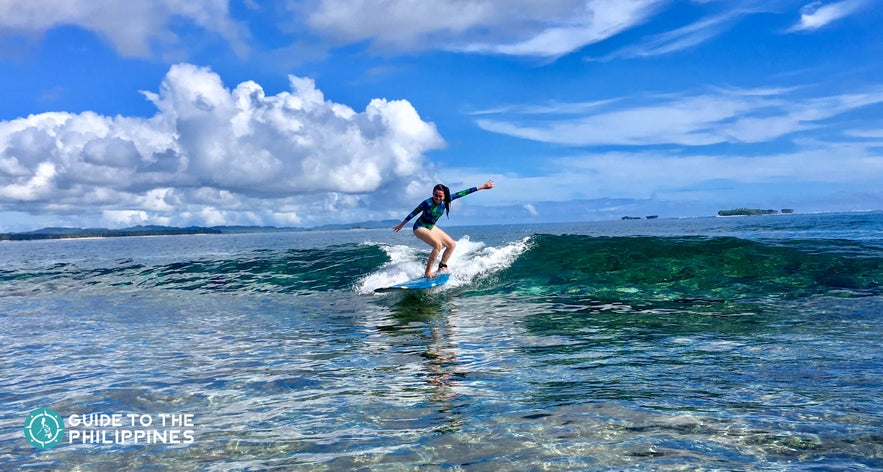 Surfer riding the waves of Cloud 9, Siargao Surfer riding the waves of Cloud 9, Siargao