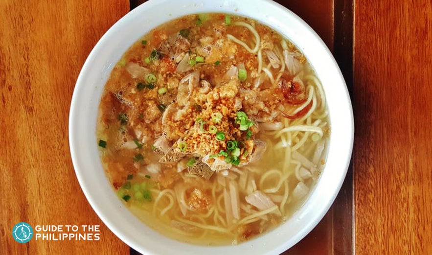 A photo of a delicious looking bowl of La Paz Batchoy, a famous local noodle soup in Iloilo Province. A photo of a delicious looking bowl of La Paz Batchoy, a famous local noodle soup in Iloilo Province.