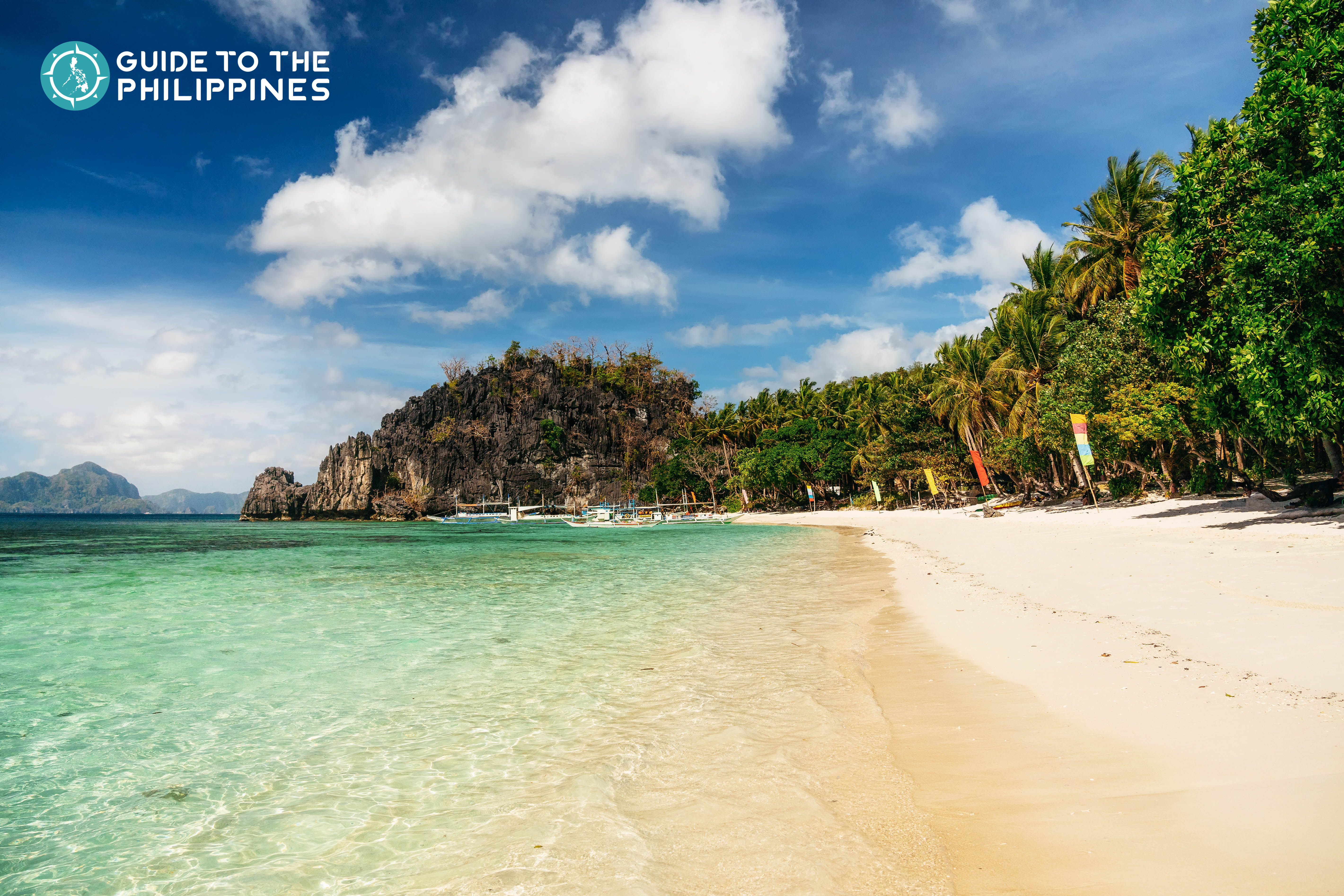Beach view of Papaya Beach in El Nido at dusk 