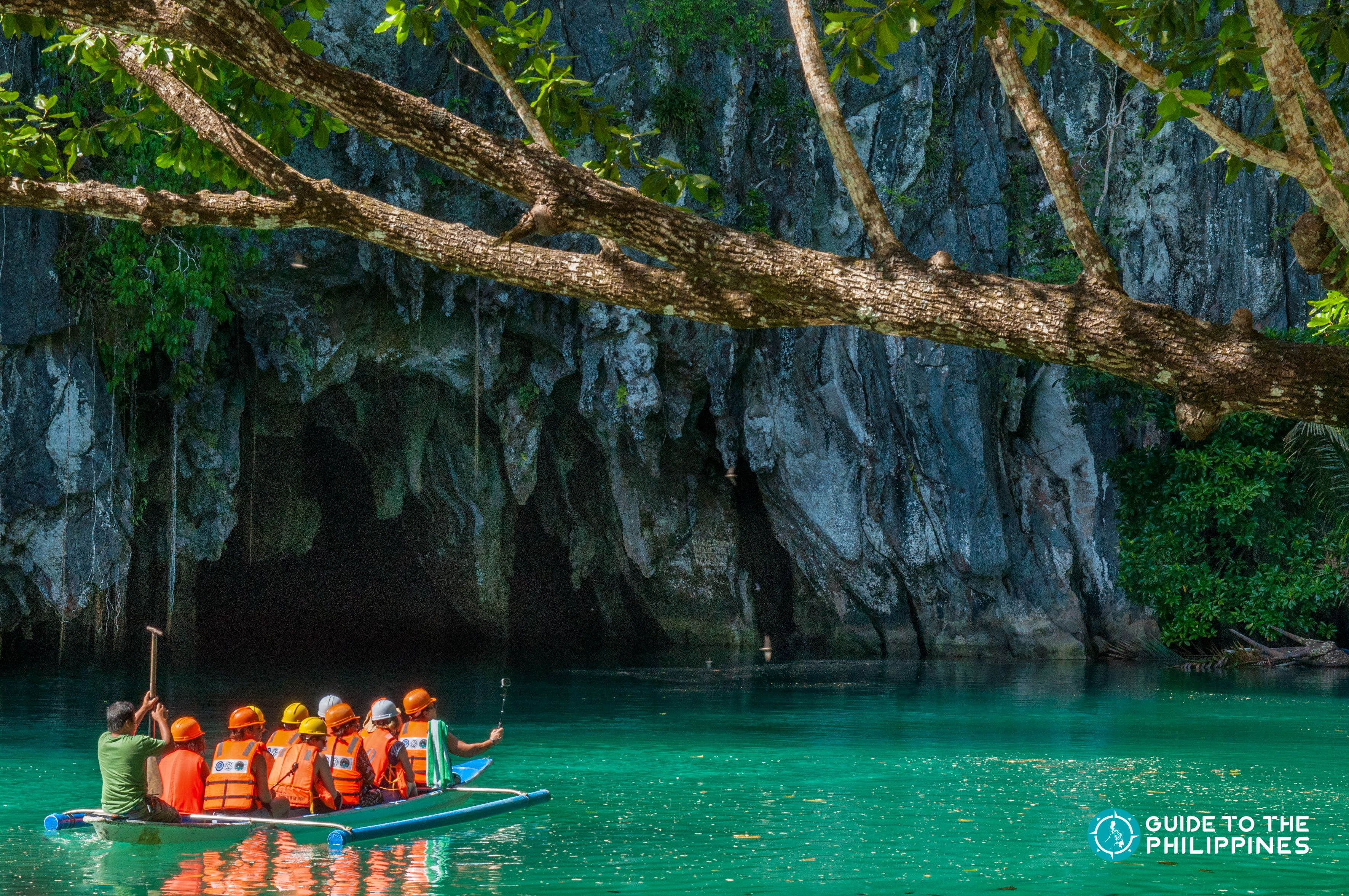 Travelers' boat going into the Underground River in Puerto Princesa, Palawan