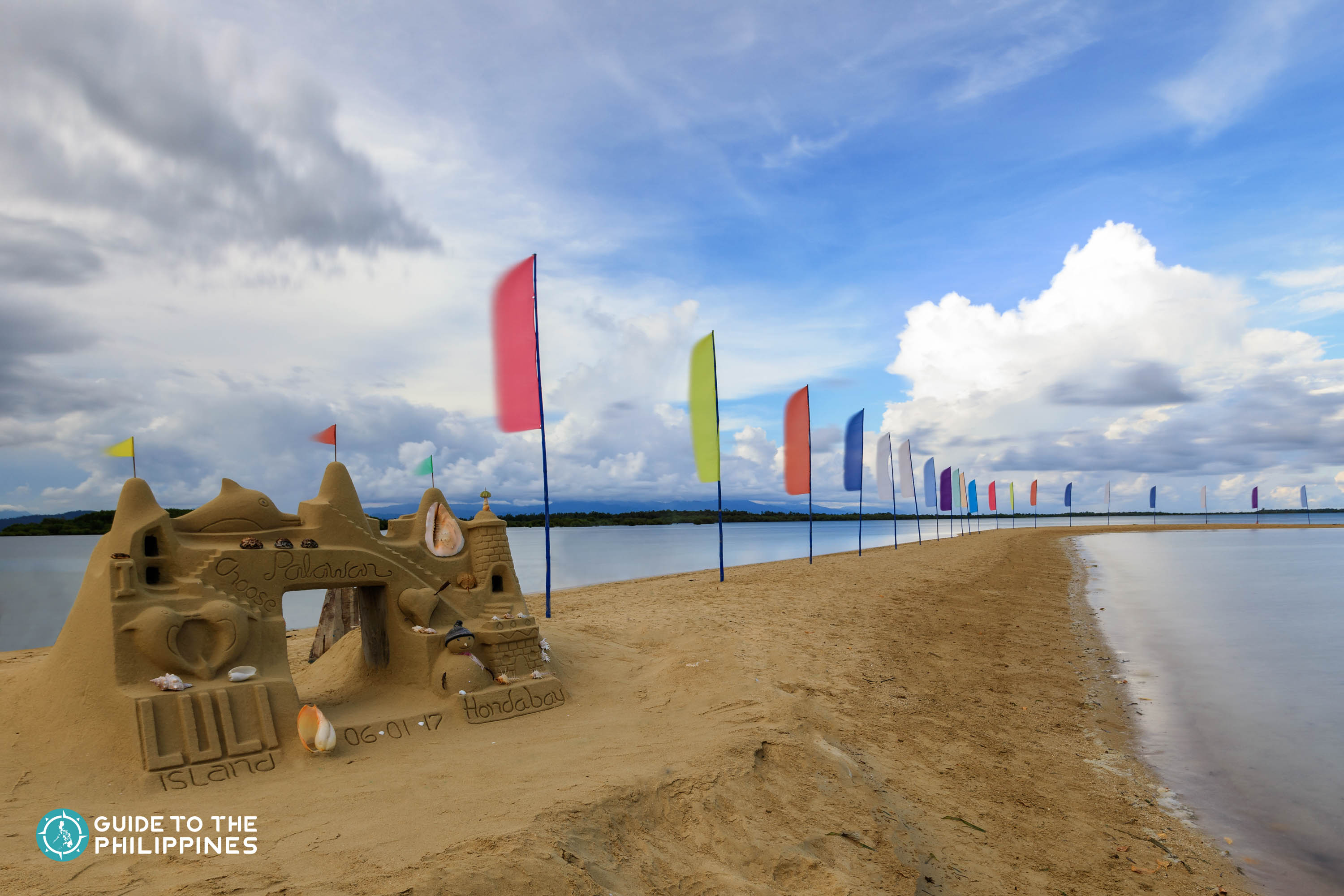 Colorful flags at Luli Island in Honda Bay, Palawan
