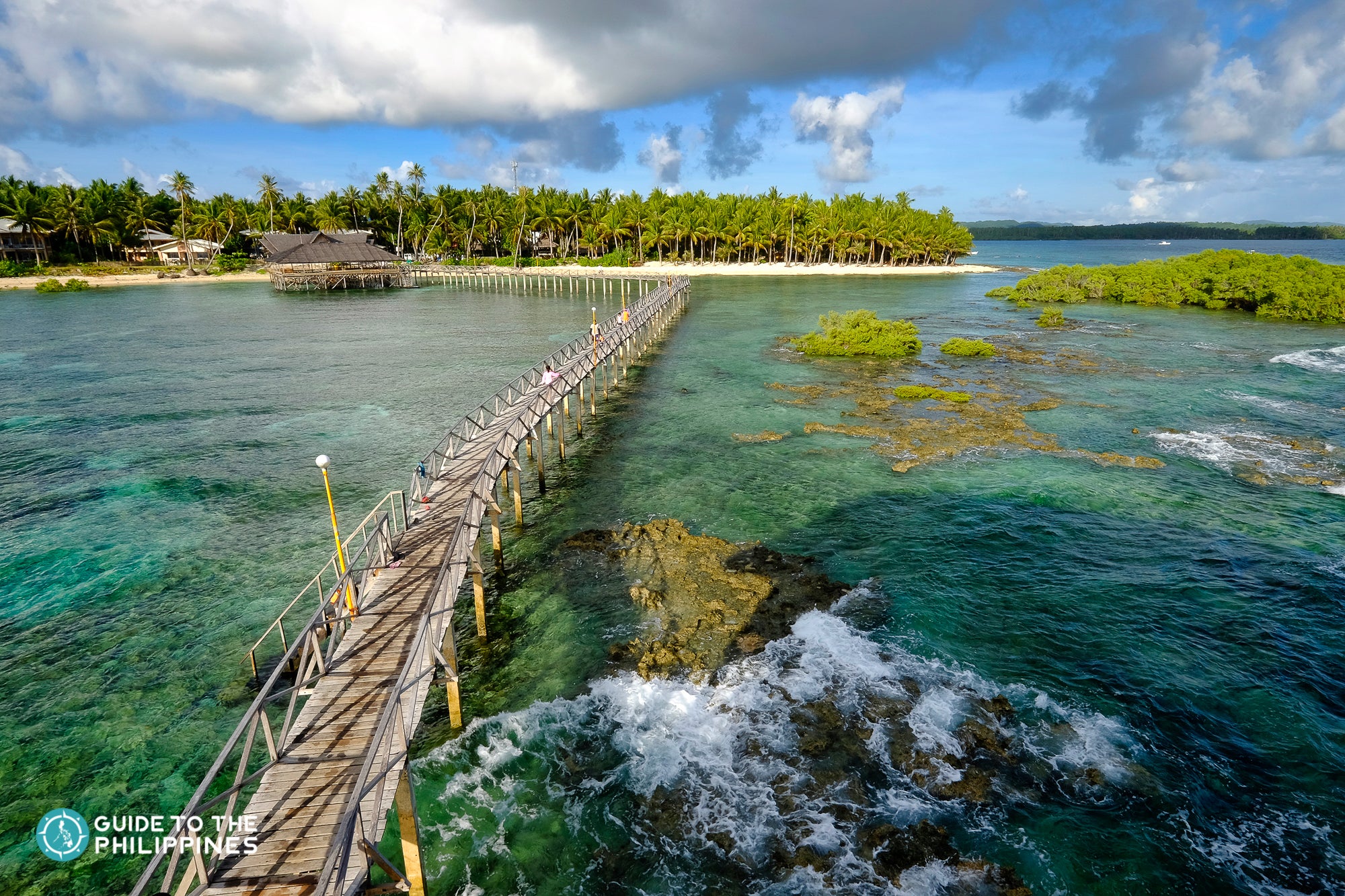 An aerial view of the iconic Cloud 9 boardwalk in Siargao Island, the surfing capital of the Philippines.