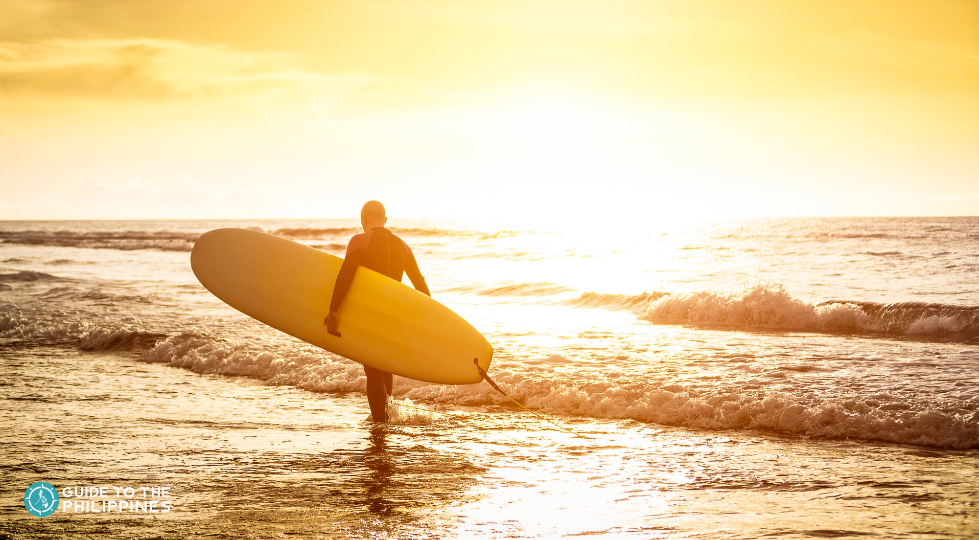 Surfer walking on the beach