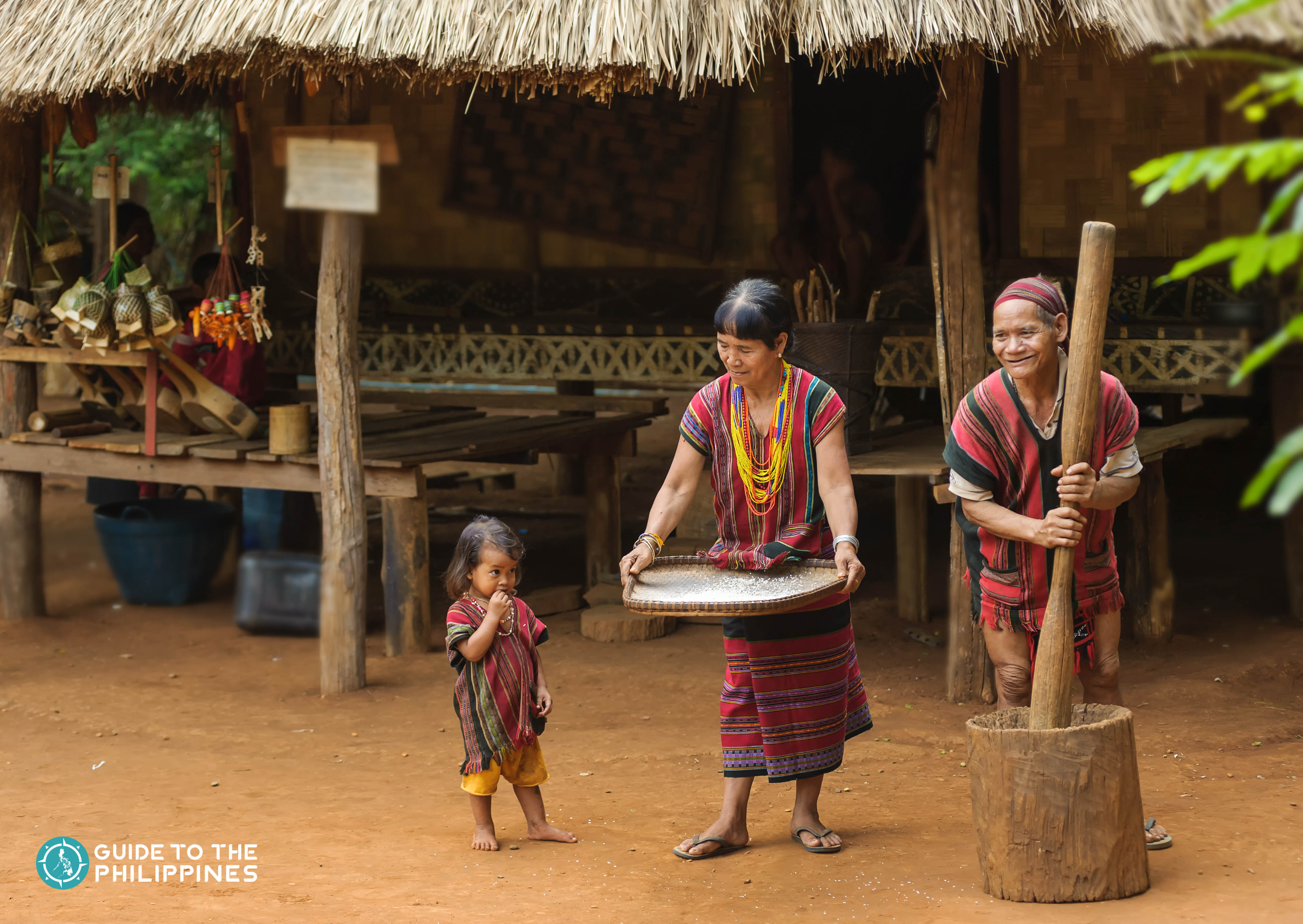 Local family milling for rice in Banaue