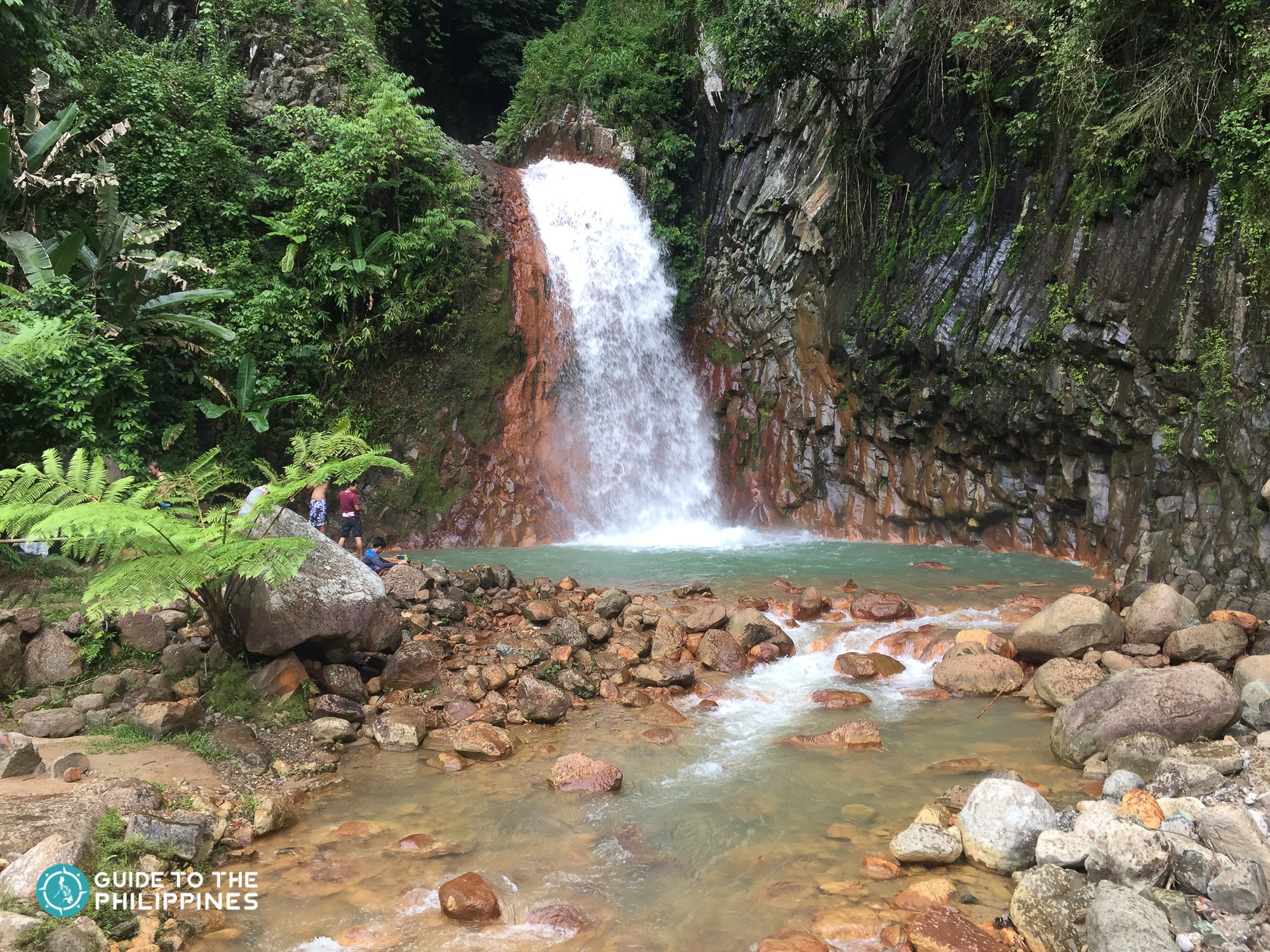 Natural red rocks of Pulangbato falls in Dumaguete