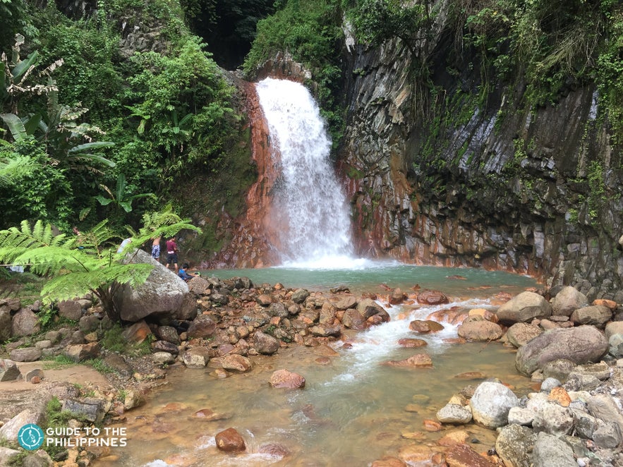 A photo of Pulang Bato Falls near Red Rock Hot Springs in Valencia town. A photo of Pulang Bato Falls near Red Rock Hot Springs in Valencia town.