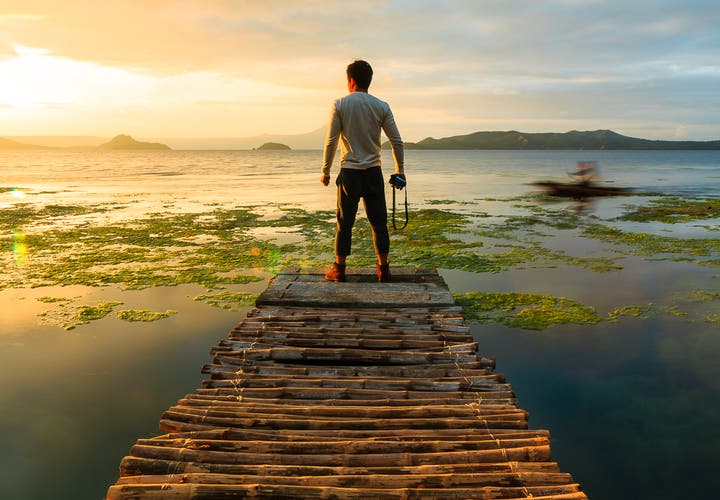 Man photographer looking at Taal Lake, Tagaytay