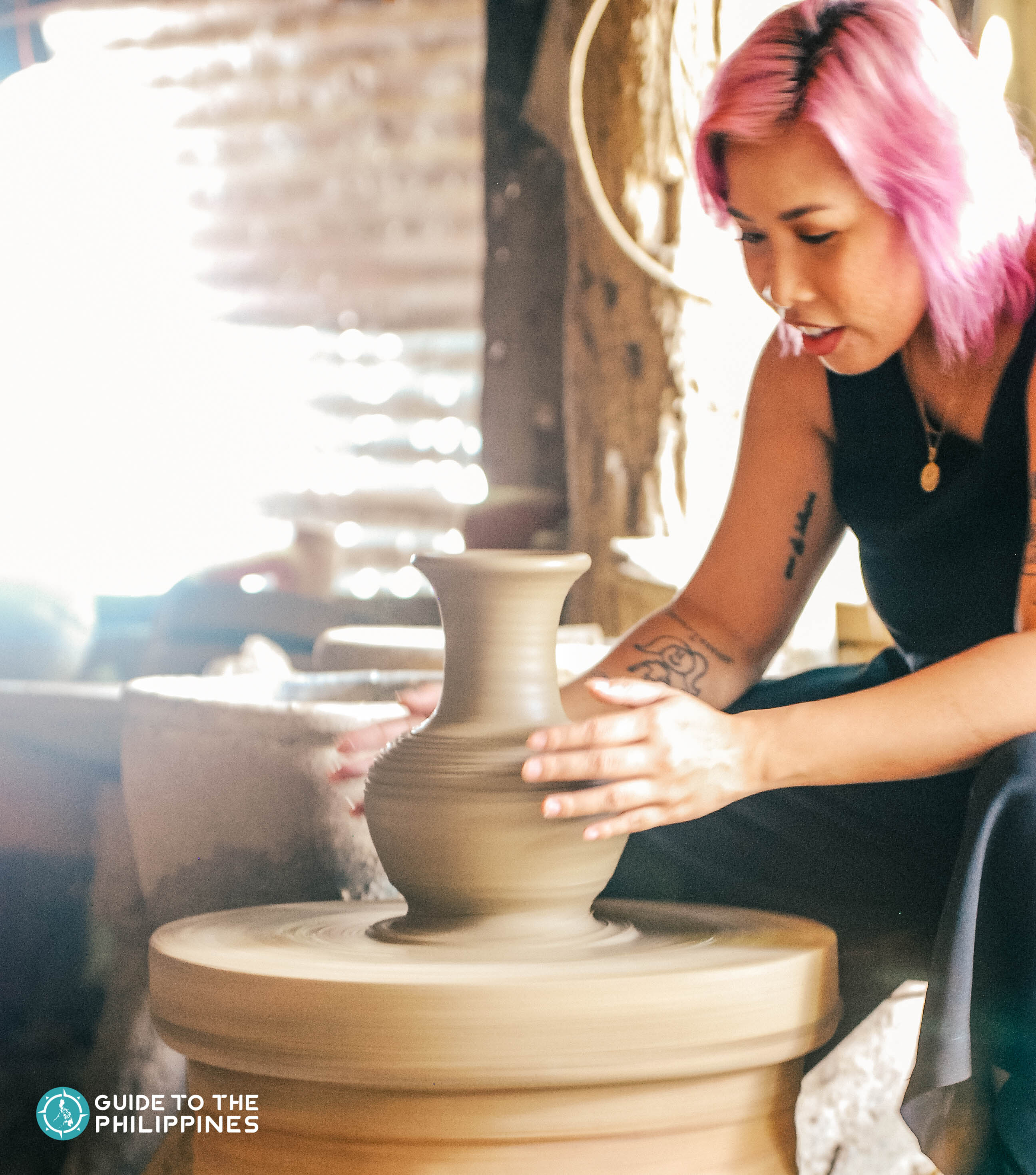 Traveler getting a hand at pottery making in RG Jar in Pagburnayan, Vigan City, Ilocos Sur