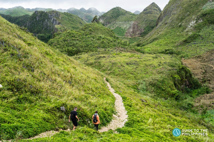 Hikers descending the Osmeña Peak in Dalaguete, Cebu, Philippines Hikers descending the Osmeña Peak in Dalaguete, Cebu, Philippines