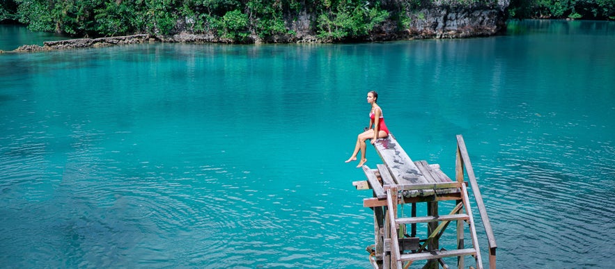 Woman traveler enjoying Sugba Lagoon in Siargao, Philippines Woman traveler enjoying Sugba Lagoon in Siargao, Philippines