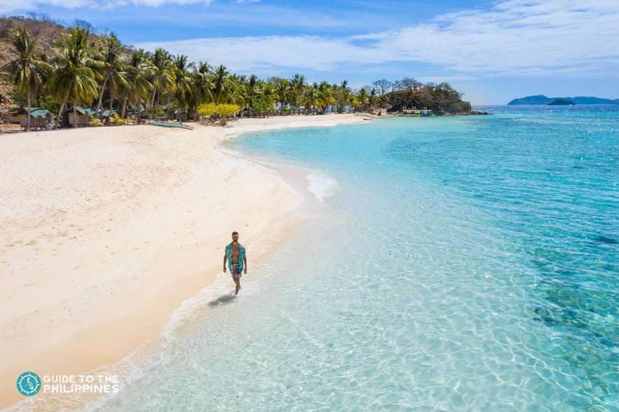 Traveler enjoying the shores of Coron, Palawan, Philippines Traveler enjoying the shores of Coron, Palawan, Philippines