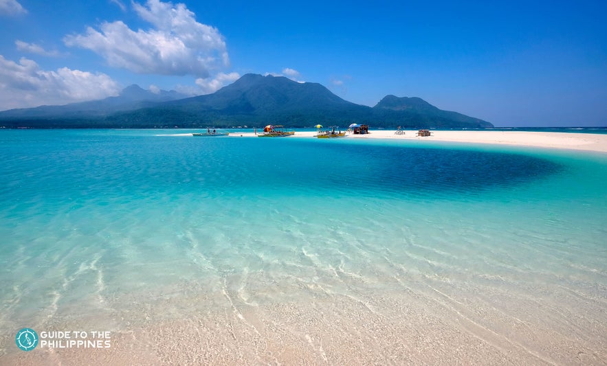 Fine sand and clear blue waters in Camiguin Island Fine sand and clear blue waters in Camiguin Island