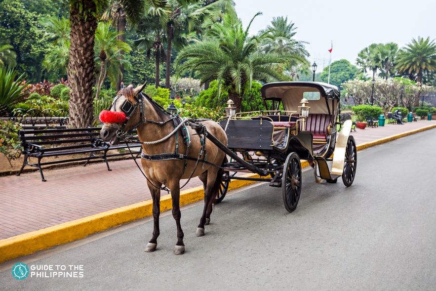 A parked kalesa or horse-drawn carriage in Manila, Philippines A parked kalesa or horse-drawn carriage in Manila, Philippines