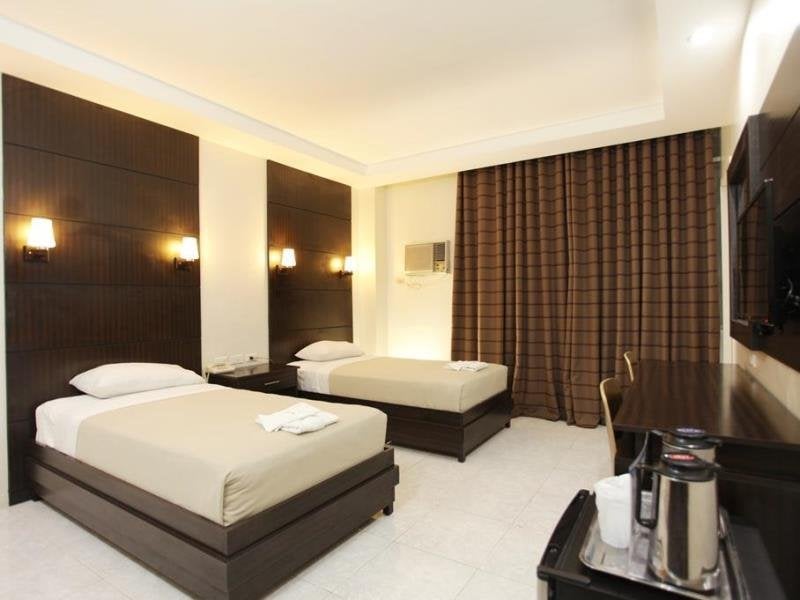 Guest room at Grand Astoria Hotel