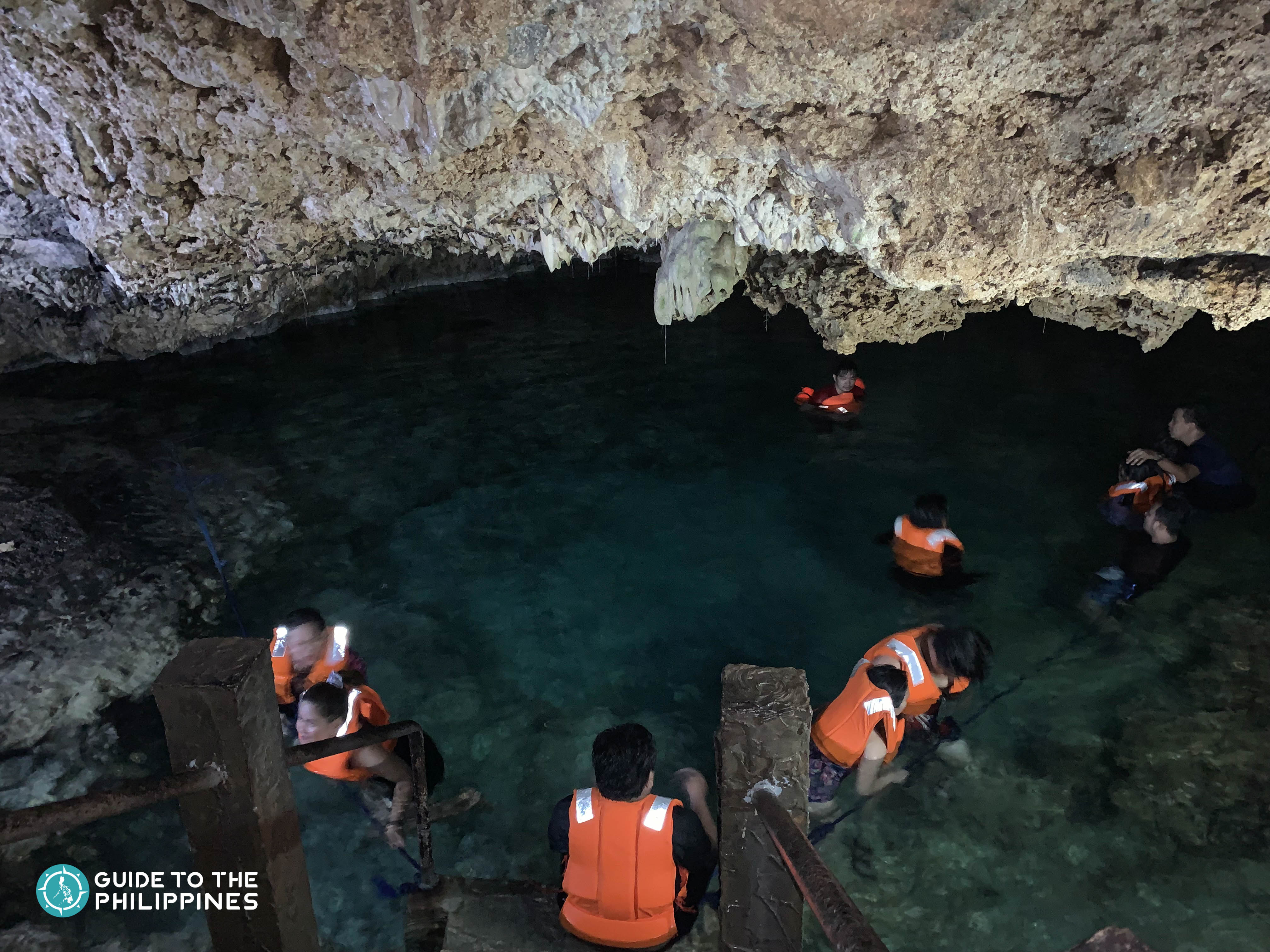 Travelers taking a dip at the Enchanted Cave in Pangasinan
