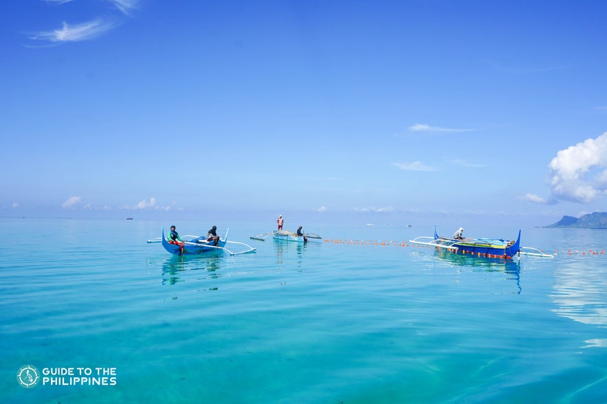 Boats by an island in Tawi-Tawi, Philippines Boats by an island in Tawi-Tawi, Philippines
