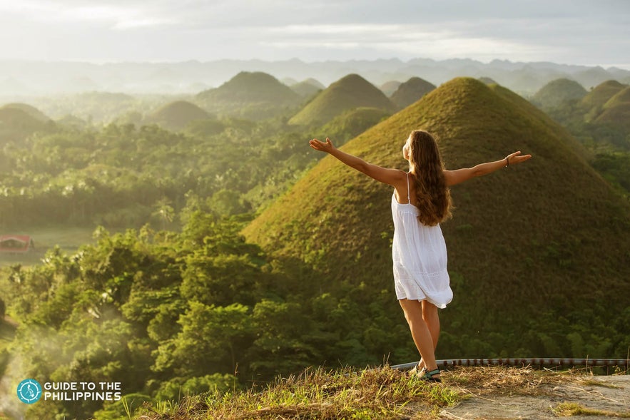 Traveler taking in the beauty of Chocolate Hills Traveler taking in the beauty of Chocolate Hills