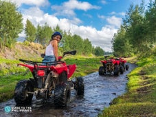 Woman riding an ATV by Max Palawan in Puerto Princesa