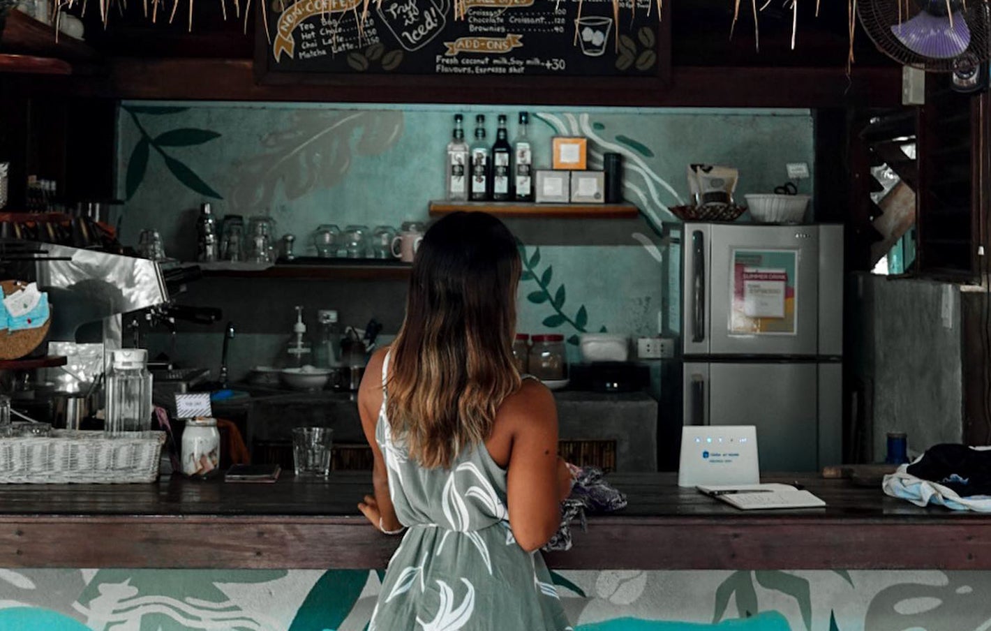 A woman waiting for her coffee in Filibeans in Siargao