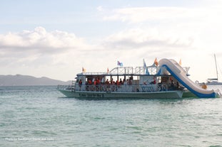 Party boat showing the big slides attached at the back of the boat