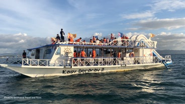 Cruisers onboard Boracay's party boat enjoying the fresh sea breeze and scenic views