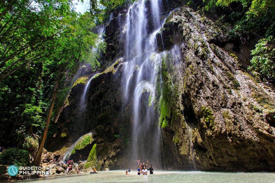 People enjoying Tumalog Falls in Oslob Cebu People enjoying Tumalog Falls in Oslob Cebu