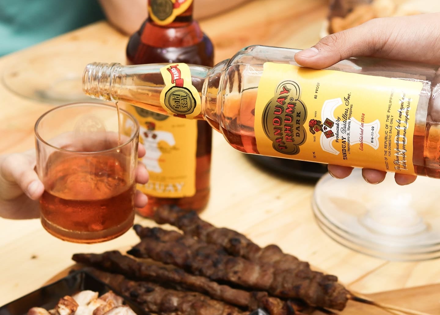 Tanduay Rhum being poured in a glass