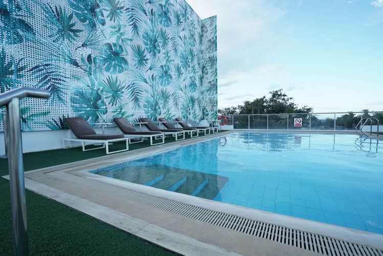 Unwind by the rooftop pool area of Tides Hotel during this 3-day, 2-night package to Boracay Island