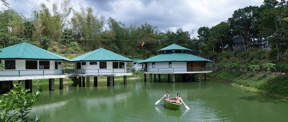 Two girls riding a boat in Ephrathah Farm in Iloilo