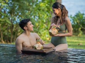 Couple enjoying the pool at Amorita Resort