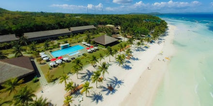 Aerial view of Bohol Beach Club Resort showcasing the pool, and wide private beach